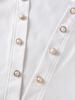 Women's Autumn Fashion Set: White Jacket with Pearl Buttons & Color Block Jumpsuit with Metal Chain Trim.