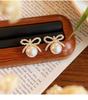 Bow earrings for women, light luxury and high-end earrings, 2026 new popular autumn and winter niche New Year earrings trend