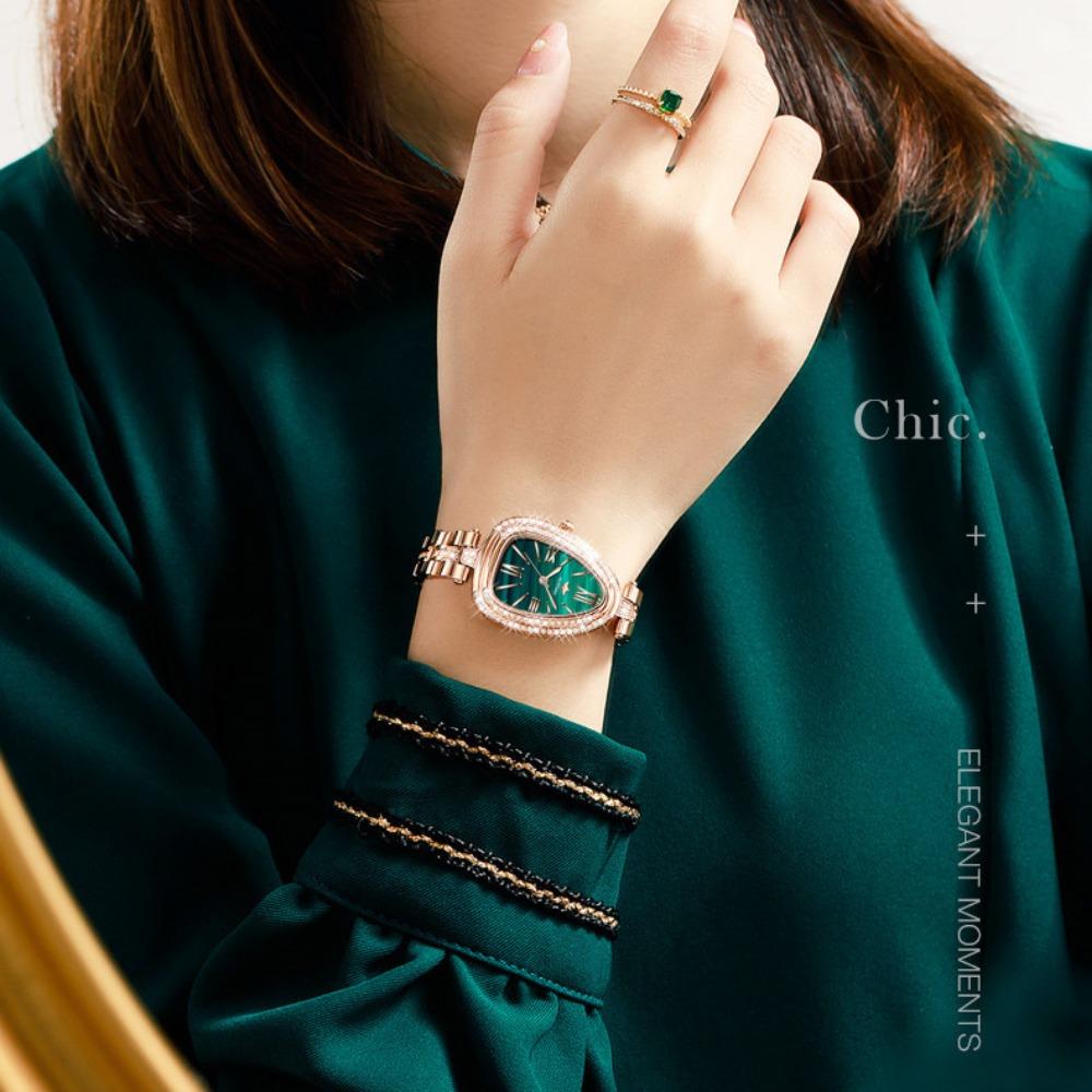 OUPINKE Montre pour femme de marque Tide avec cadran serpentin incrusté de diamants Montre à quartz étanche haut de gamme de grande valeur