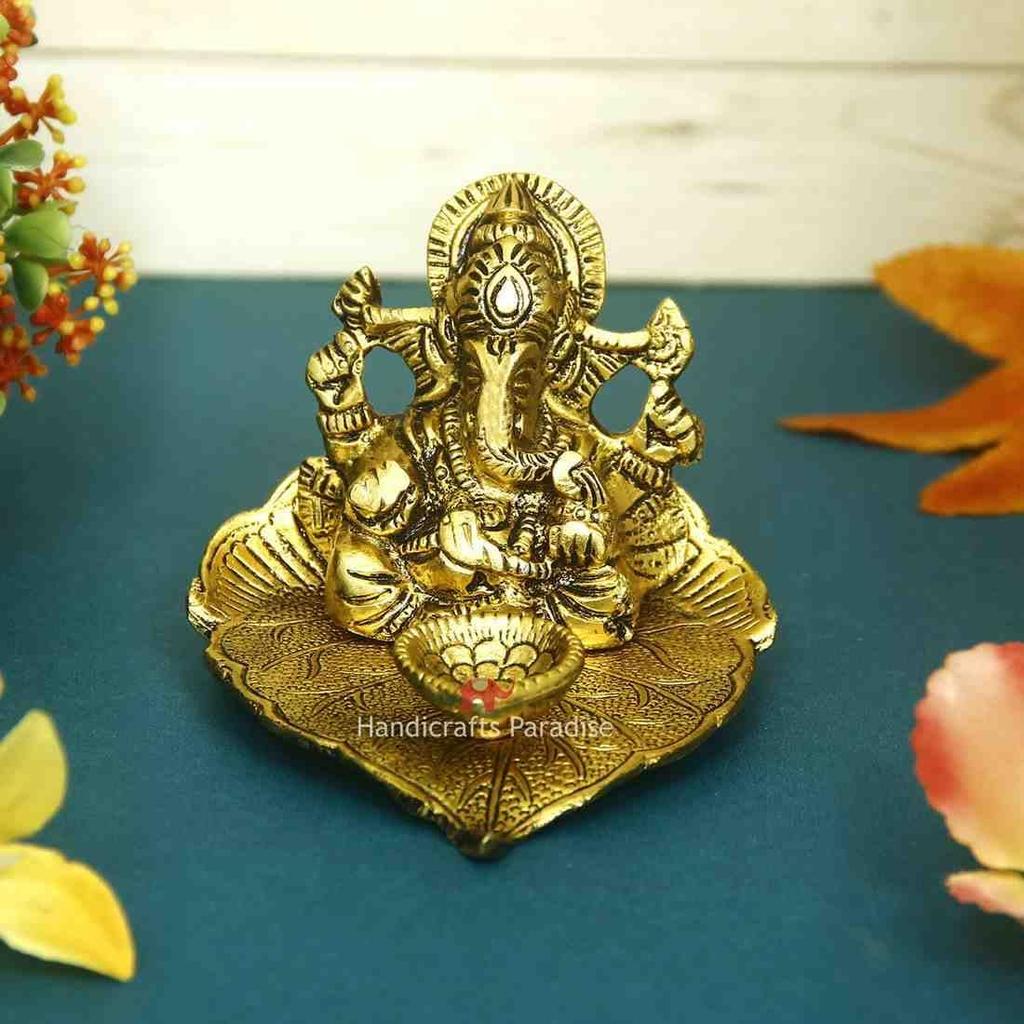 Metal Diya Pipal Leaf Shape with Ganesha Figurine, Gold, 4.25 X 3.75 X 2.5 Inch, 1 Pcs