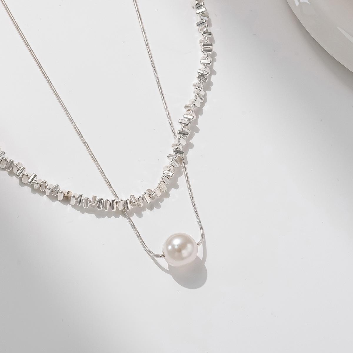 

New bow necklace women s simple high-end sense retro double-layer stacked wear design sense imitation pearl collarbone chain