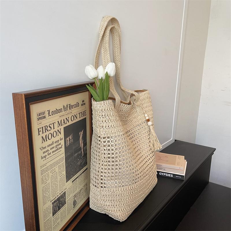 Woven Straw Tote with Tassel Accent and Spacious Interior for Summer Beach or Casual Daily Use