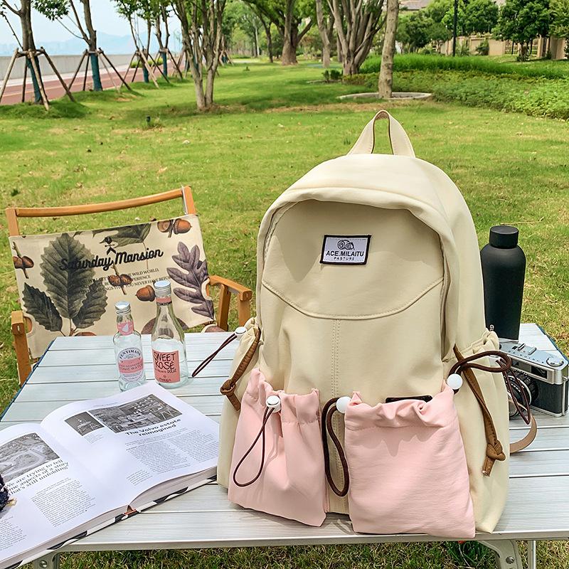 New high-value college-style men's and women's schoolbags, Korean version school students, contrasting colors, casual commuting, versatile backpack.