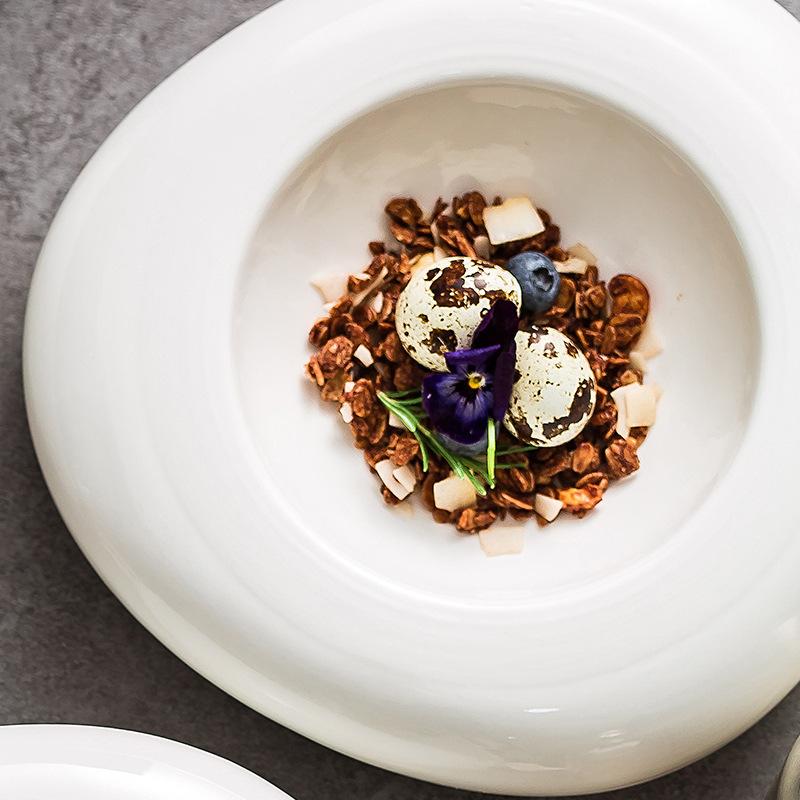 High-end hotel restaurant ceramic insulation plate white irregular position on the western food cold dish plate.