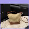 Borsa a secchiello intrecciata in paglia con chiusura a zip per uso casual diurno