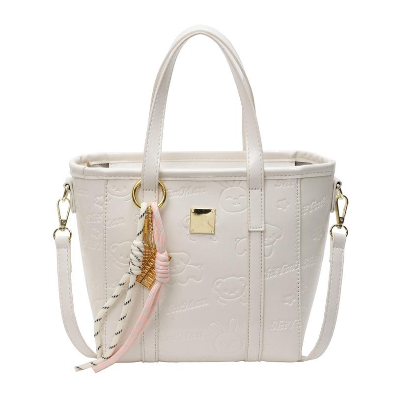 Korean version of high-end fashion and cute embossed portable bucket bag, women's commuting versatile foreign style messenger bag
