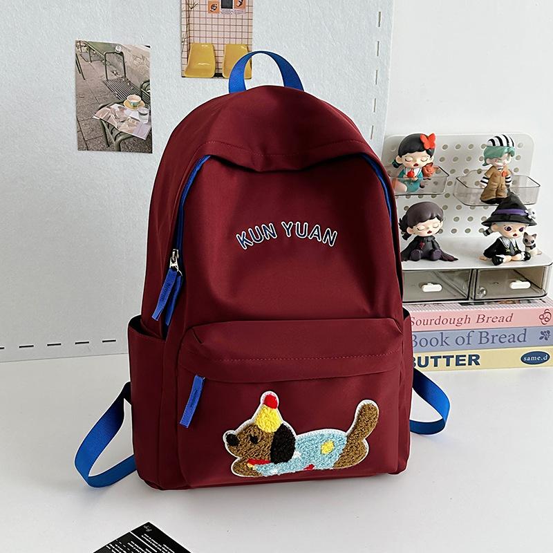 Schoolbag new cute puppy backpack large capacity primary school students junior high school students lightweight schoolbag simple fashion alphabet 