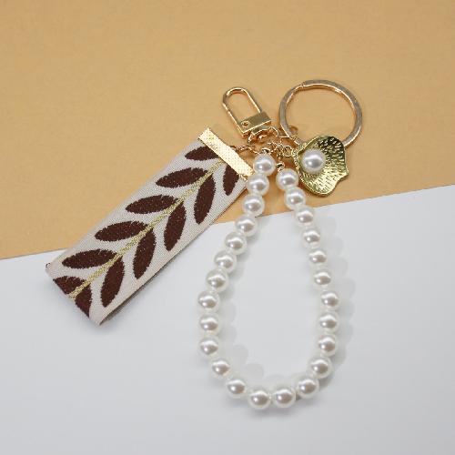 Trending 2025 Keychain Set Fashion Minimalist Pearl Car Keychain Woven Stripe Bag Charm Elegant Women Keychain Organizer Gift