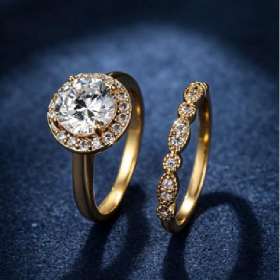 Round-cut halo ring with a central gemstone Light luxury diamond-studded stacking rings