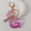 Purple Iridescent Resin Letter Keychain with Butterfly Tassel