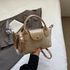 Bolso de mano simple casual primavera 2026 bolso de mujer sensación nicho bolso tipo empanadilla bolso bandolera versátil para el trabajo
