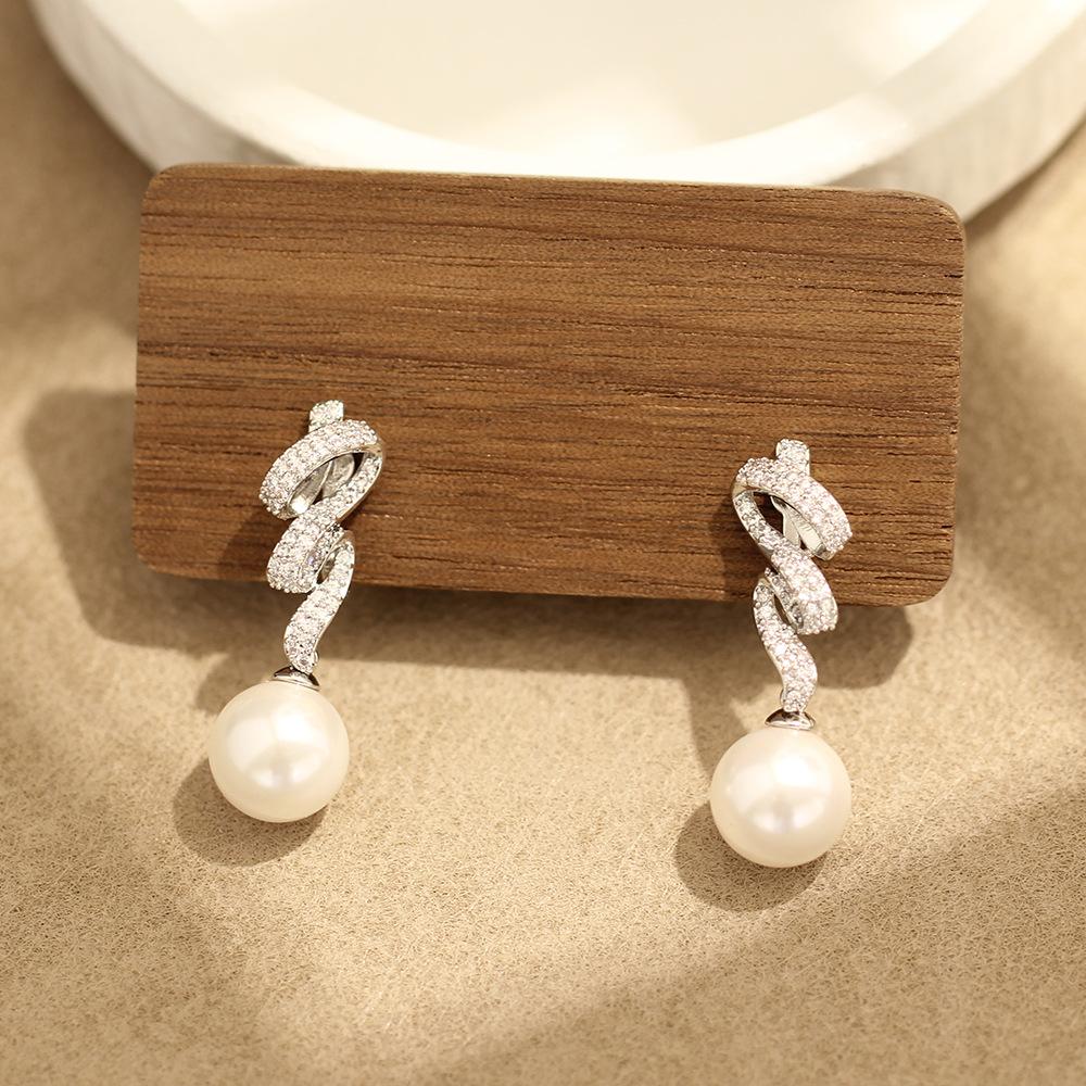 

Japan and Korea exquisite niche temperament stone ribbon shape earrings simple versatile pearl earrings earrings without earrings women