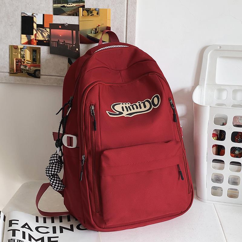 School bag Elementary school student Junior high school student High school student College student Female large capacity burgundy men's backpack