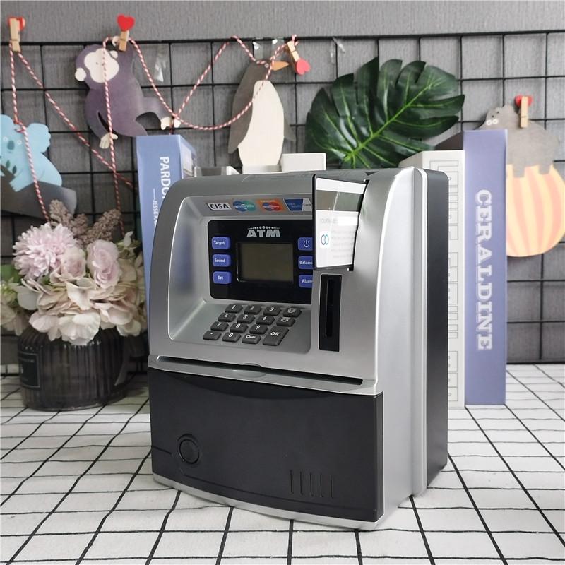 

Трансграничный банкомат-сейф для монет и наличных с голосовым паролем и функциями банкомата 19.5 x 12.5 x 22.5 cm серебряный