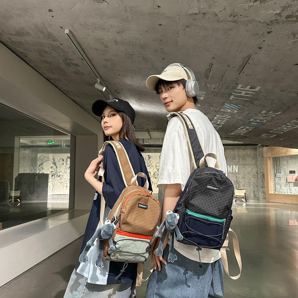 Schoolbag1011 new high-value contrasting color splicing backpack bag, male and female students schoolbag, outdoor travel backpack, large capacity