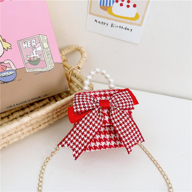 

Stylish And Cute Red Pearl Handbag For Girls Featuring Adorable Butterfly Bow Accent Houndstooth Bow