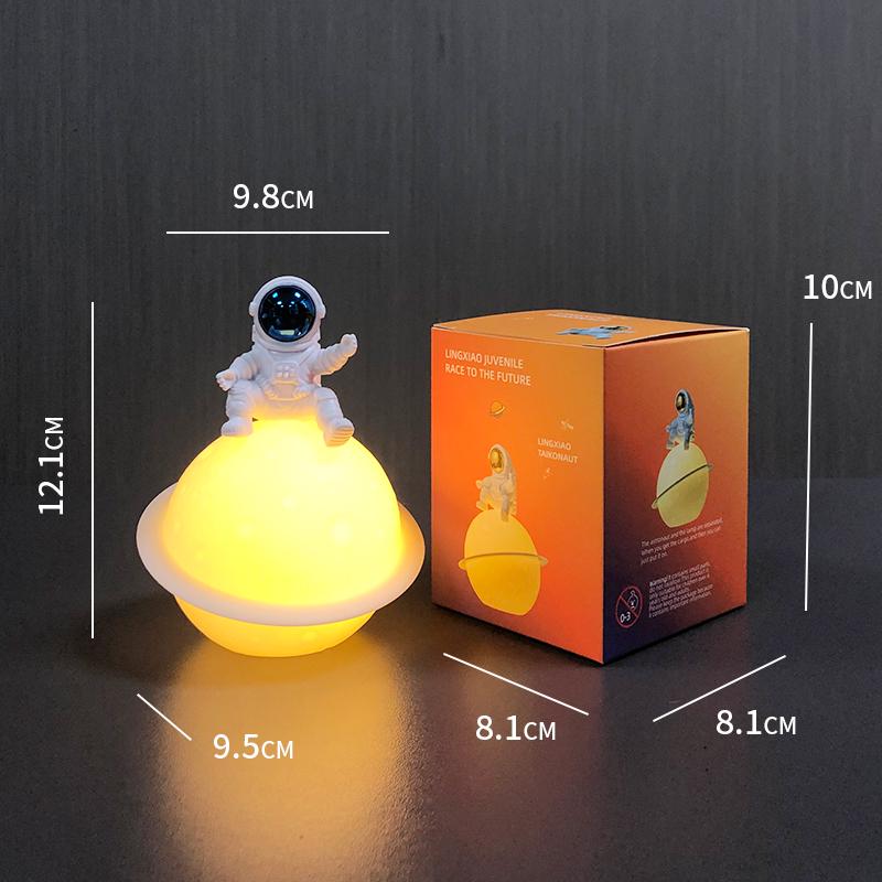 Astronaut Night Light Planet Lamp: Luminous Moon Ornament for Bedroom Decor, Gift, or Souvenir with Silk Flower.