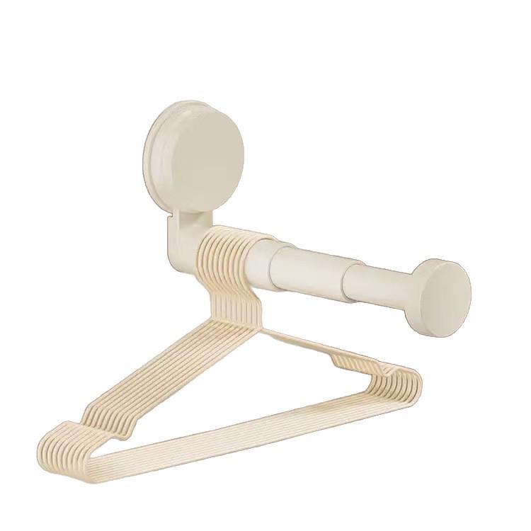 Telescopic No-Punch Suction Cup Wall Rack: Multi-functional Balcony Clothes Storage and Hanger Shelf with Traceless Hooks.