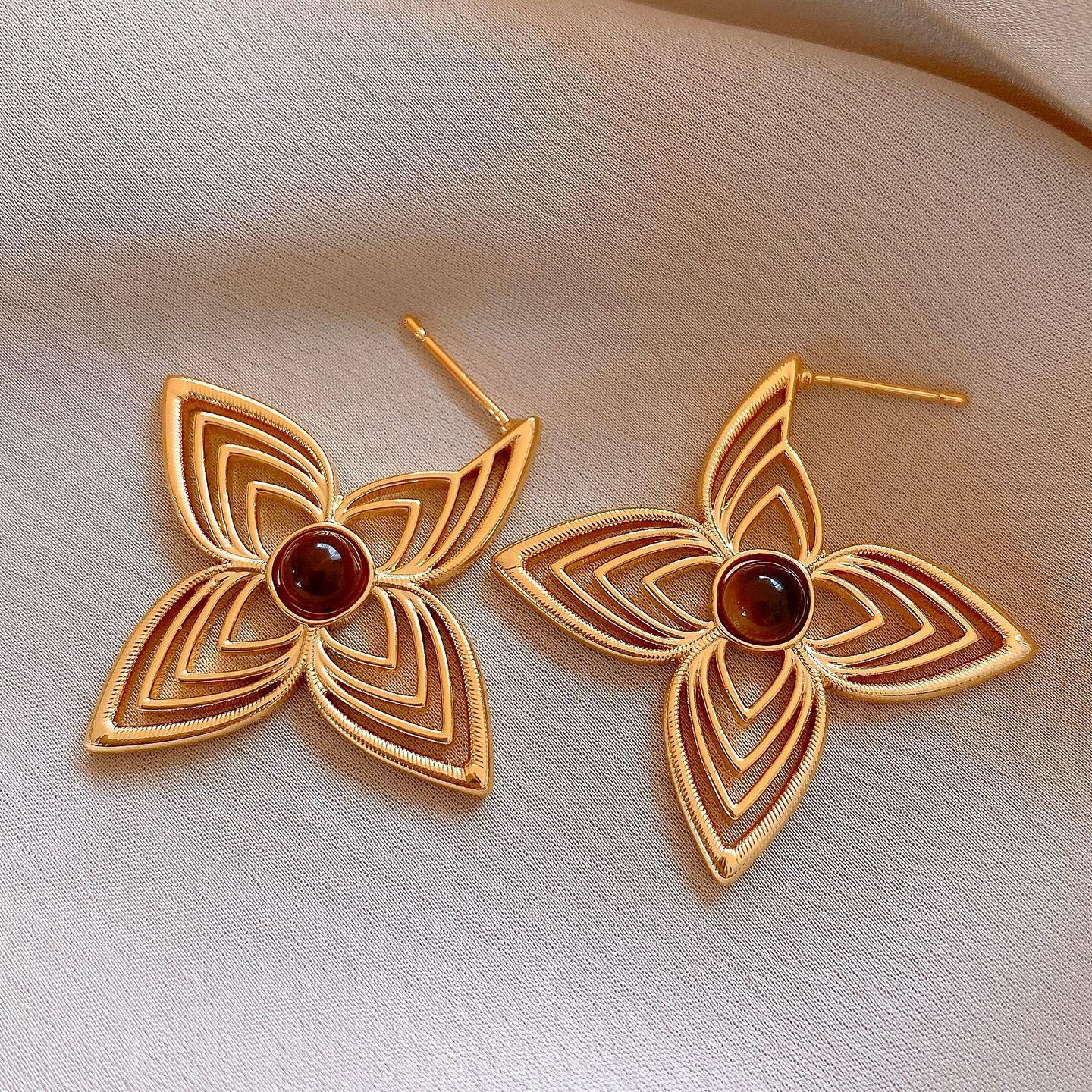 Electroplated silver needle flower hollow earrings stud earrings cold wind personality niche earrings