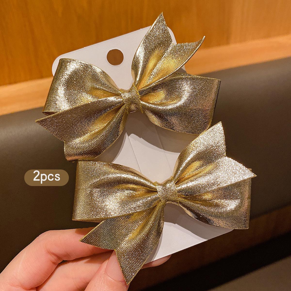 

4 fashionable bow hair clips in gold and silver, suitable for daily use as hair accessories