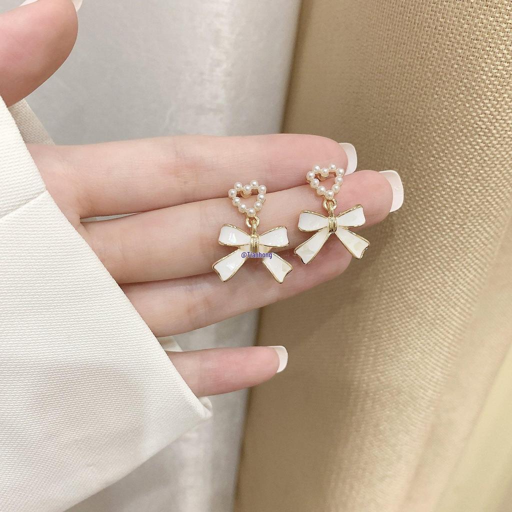 2025 Pearl Bow Stud Earrings: Trendy Minority Design for Women - Ear Clips & Accessories