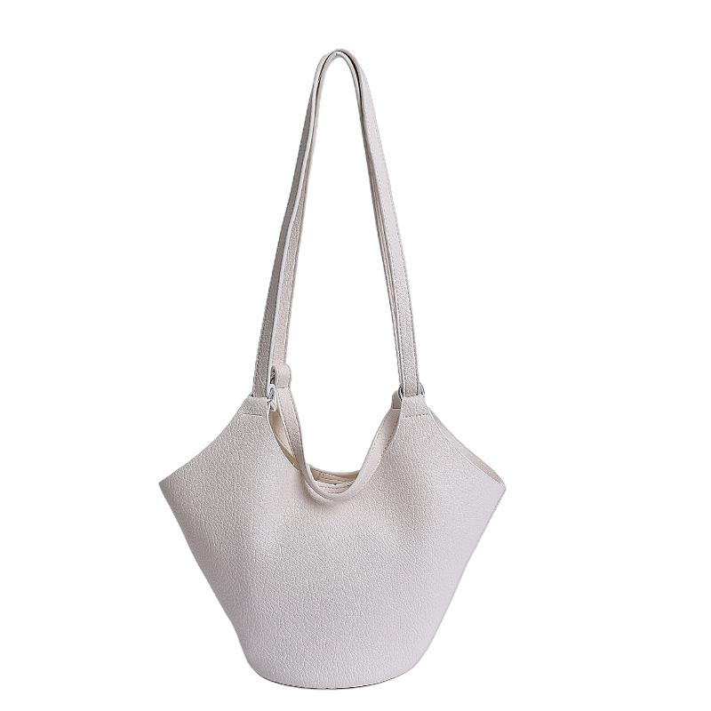 Niche high-end soft leather vegetable basket hand carrying bucket bag women's new commuter shoulder armpit bag