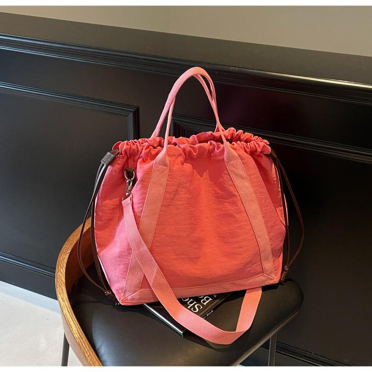

Niche casual tote bag large-capacity fashion bag multi-purpose shoulder cloth bag oblique span bag new women s bag роза розовый