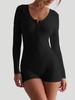 Combinaison moulante longue à manches longues taille haute rose et noire avec fermeture à boutons pour le sport