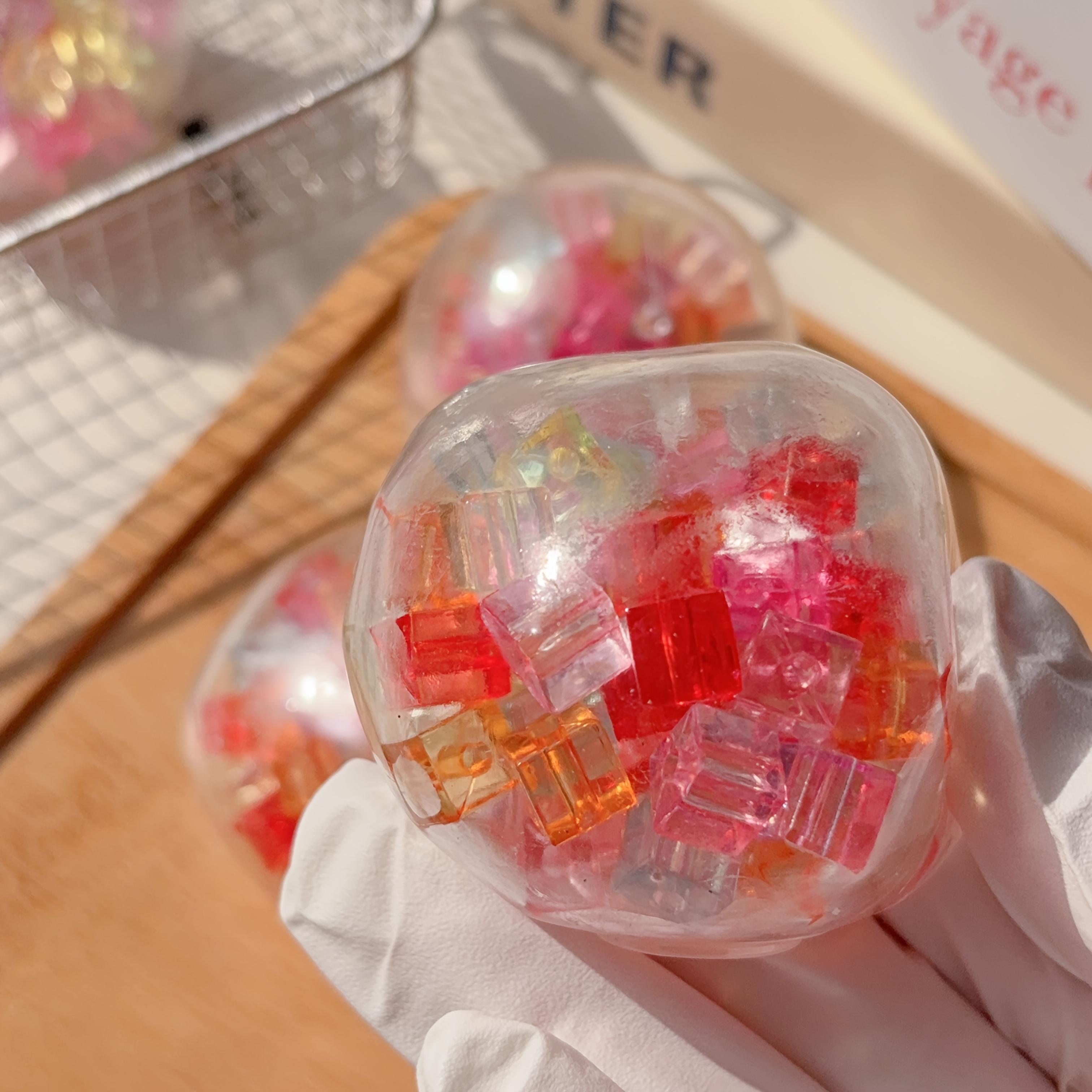 

Cute 7‑Color Bead‑Filled Squeeze Cube Toy, Soft Slow Rebound Fidget Ball for Kids & Holiday Gifts A multicolored ice cube hand-made ball
