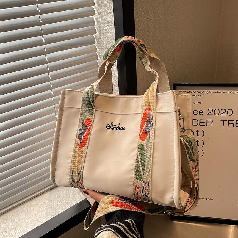 Velkokapacitní dámská letní všestranná taška 2024, nová módní texturovaná plátěná taška přes rameno, dojíždějící taška přes rameno