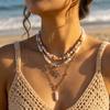 Bohemian Handgefertigter Seestern Sonne Anhänger Halskette für Damen Sommer Muschel Imitation Perle Reiskorn Perlen Choker Strandurlaub Schmuck
