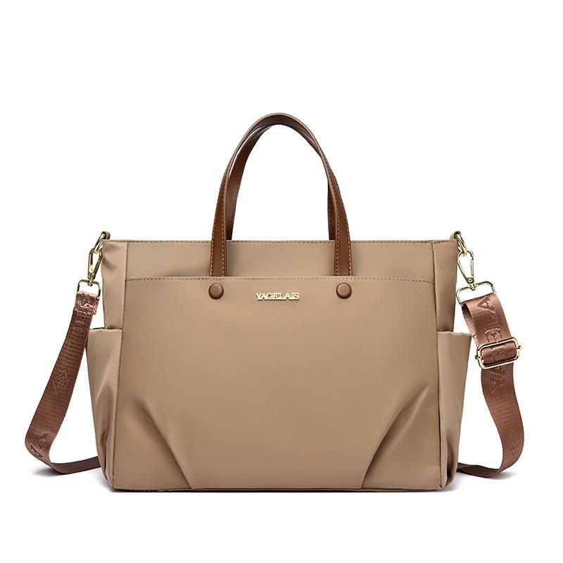 A Laptop Bag, A Lady Carrying A Business Briefcase and Slung A Commuter Tote Bag Across Her Shoulder