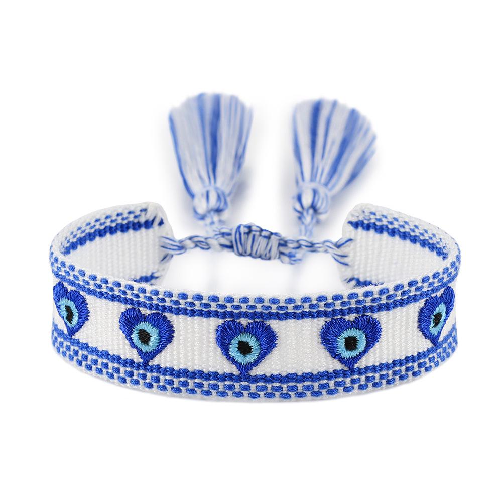 Blue-Eyed Lucky Charm Tassel Bracelet: Handmade European & American Style Woven Demon Eye for Women