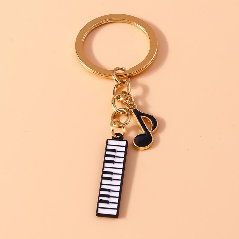 

Cute Piano Guitar Keychain Simulation Musical Instruments Key Ring Pendants for Handbag Decor DIY Key Chain Gifts