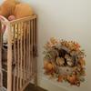 Autumn Squirrel Wall Sticker Featuring Two Squirrels Perched in Tree Holes. Pumpkins and Autumn Leaves Surround Them.