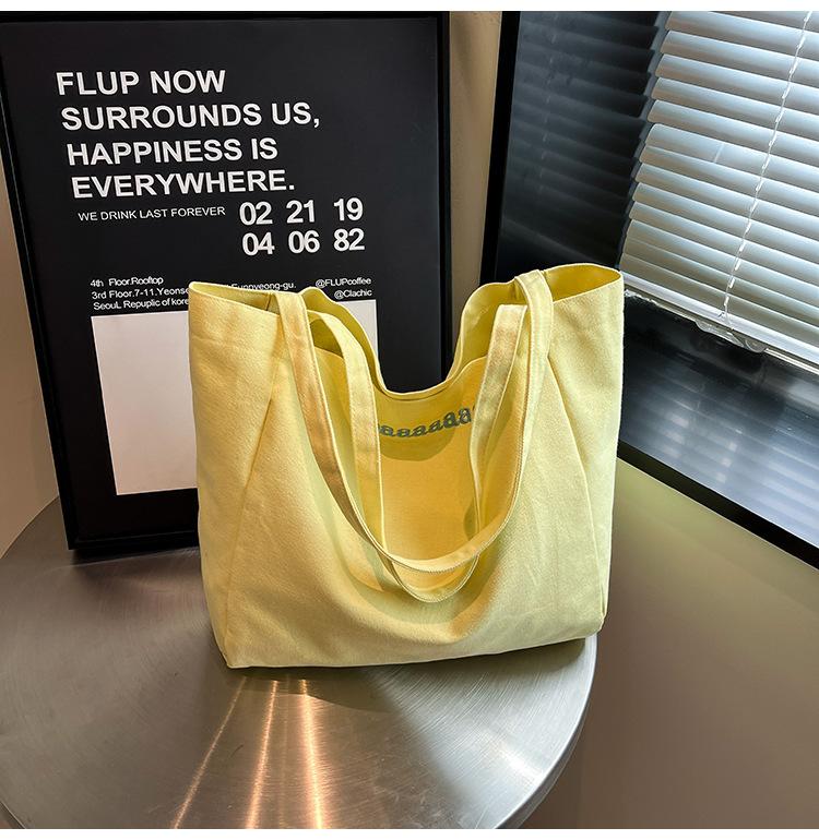 

2025 Japanese style new commuter niche large-capacity student women s canvas bag simple daily back leisure tote bag жовтий