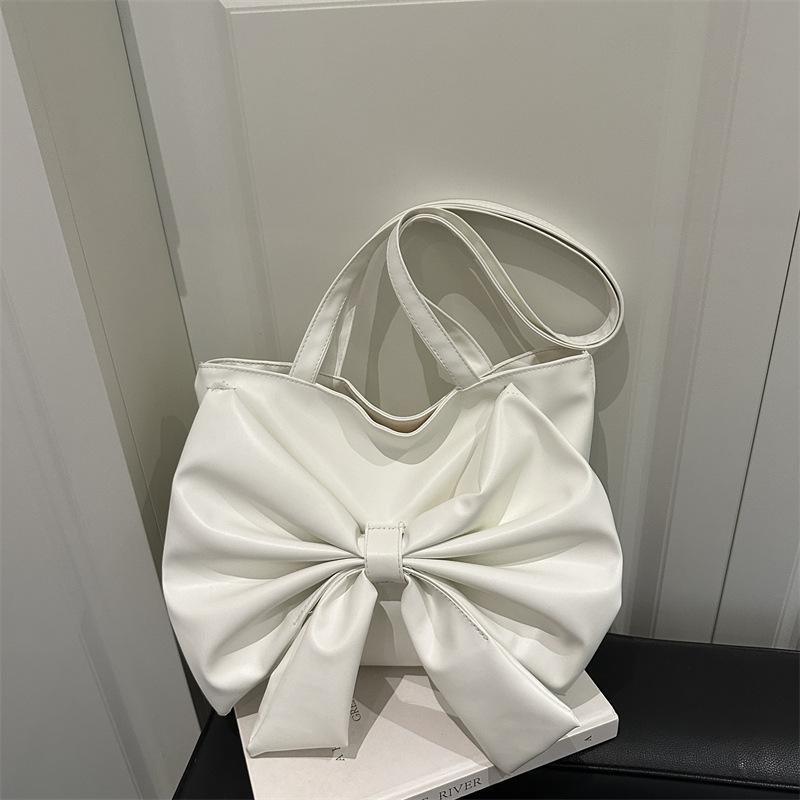 Niche fashion foreign shoulder bag 2025 summer new Korean version girl bow commuter tote bag