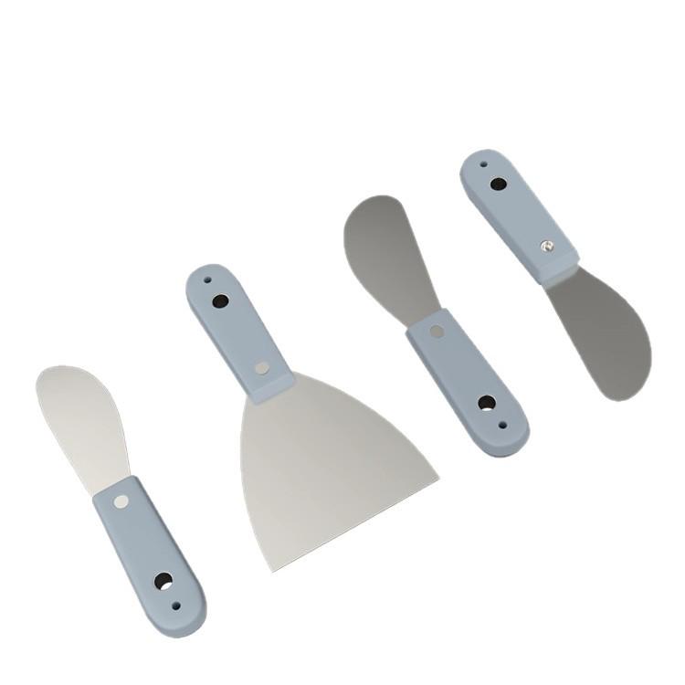 Exterior Wall Scraper and Adhesive Applicator for Grouting, Sealing, Trimming, and Leveling Windows and Doors.