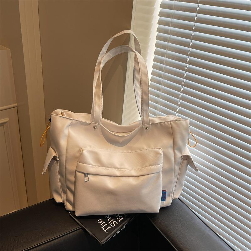 

Large capacity bag women s new fashion commuter shoulder armpit bag student class portable tote bag