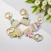 Radiant Bow Perfume Bottle Keychain & Elegant Bag Pendant Gift