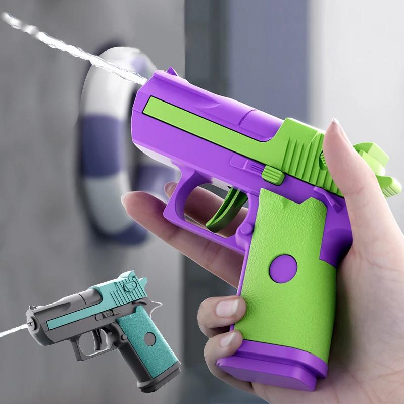 Mini Desert Eagle Pistola ad acqua meccanica a fuoco continuo Piccola pistola Estate All'aperto Spiaggia Giocattolo povero Spara pistola ad acqua per bambini