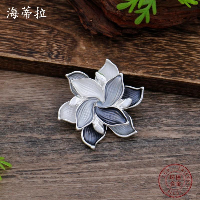 New enamel color hollow geometric camellia magnetic brooch women's fashion versatile three-dimensional flower corsage