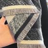 Middle East new camellia jacquard imitation cashmere scarf women's short tassel high-end black shawl