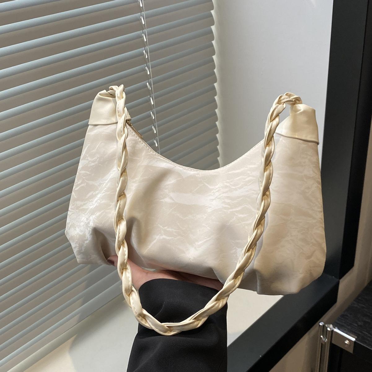 

Folded cloud underarm bag niche design bag women s 2025 new summer high-end texture shoulder messenger bag рожевий