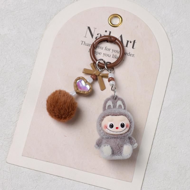 Sitzender Beflockungs-Schlüsselanhänger DIY Niedliche Korn Einzelpuppen-Zubehör Weichkleber Niedliches Korn Baby Lauftasche Handy-Anhänger