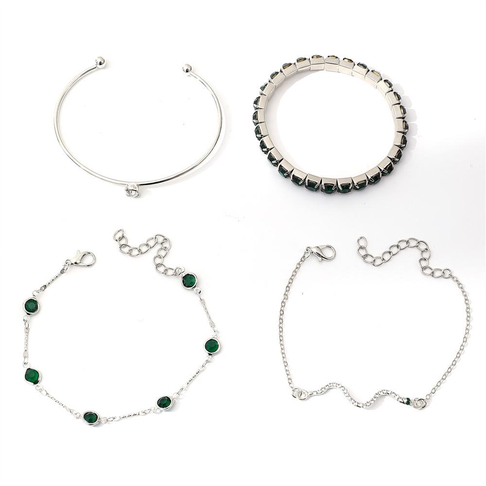 European & American Fashion Green Snake Diamond Bangle Set: Women's 4-Piece High-End Metal Jewelry with Elastic Design.
