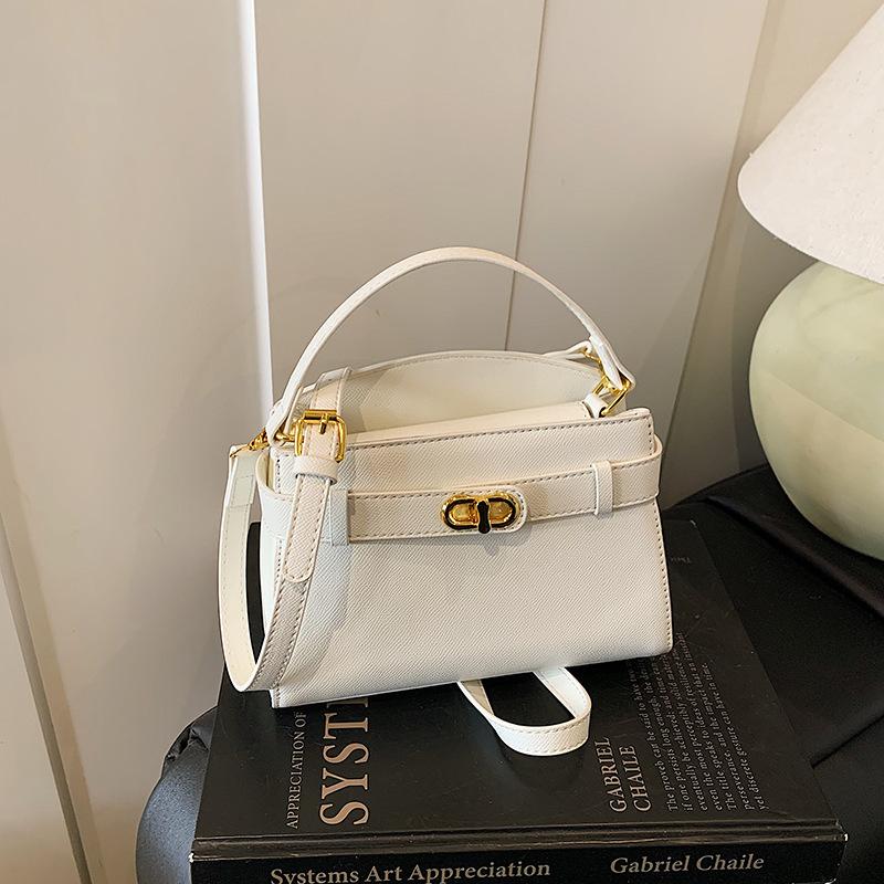 

Женская сумка Kelly новая текстура нишевая ретро металлическая пряжка сумка на плечо для通勤 универсальная сумка-мессенджер