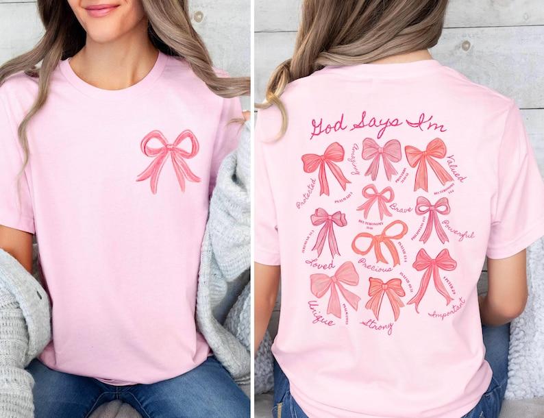 

God Says I Am Coquette Bow Shirt Christian ShirtChristian Girl Gifts Valentine Christian TeePink Coquette Bow Trendy Bible 4XL