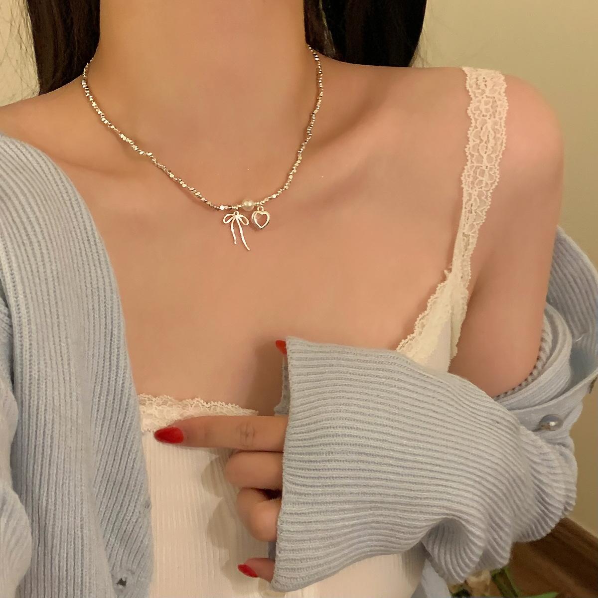 

Blast Shattered Silver Bow Pearl Necklace Female Ballet Style Design High Sense Clavicle Chain Sweet Neck Chain Autumn Winter