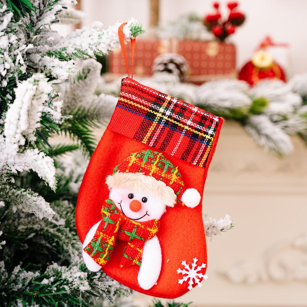 Decorative Red Christmas Stockings With Fun Cartoon Designs Of Santa Snowman Reindeer Bear For Vibrant Celebrations Festive